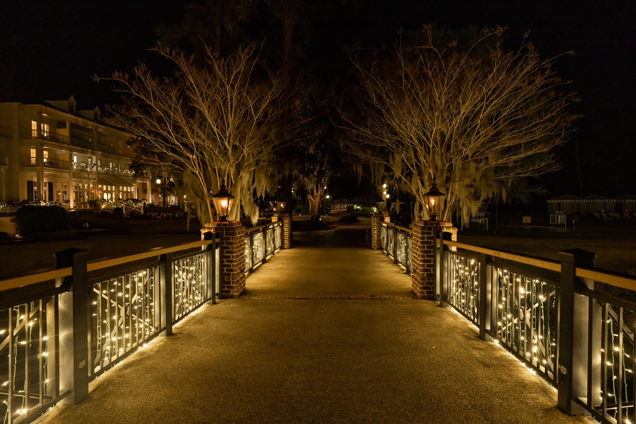 Illuminated bridge pathway at night